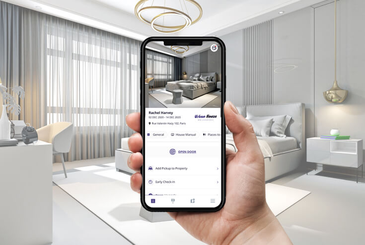 hand holding phone in hotel room, mobile app